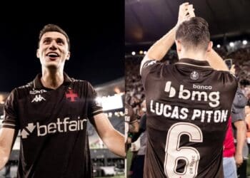Goleiro do Vasco comemorando vitória, estádio lotado ao fundo.