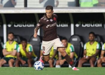 Vasco player with ball on field volleyball, brown uniform, number 10, in action during match.