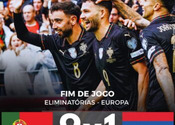 Resultado de uma partida de futebol entre Portugal e Armênia, com placar 9x1, mostrando jogadores comemorando na torcida.