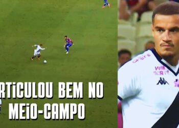 Imagem de jogo de futebol no meio-campo com jogadores em ação.