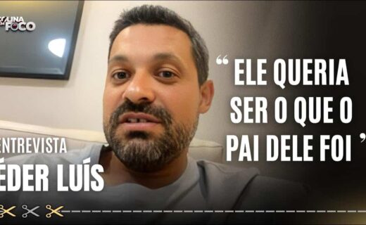 Homem com barba e expressão séria.